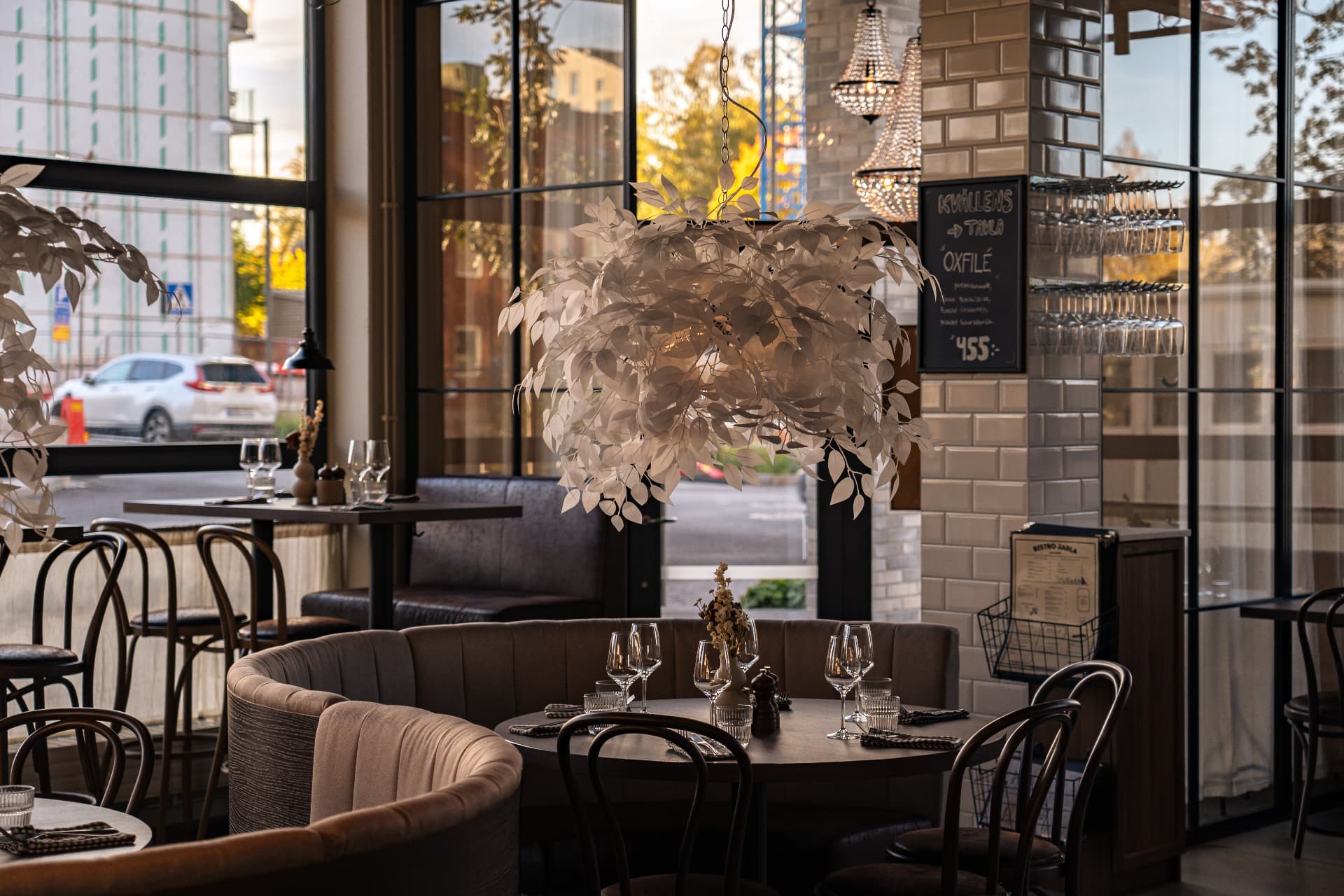 Bistro Jarla’s dining room in daylight with the white leaf installation