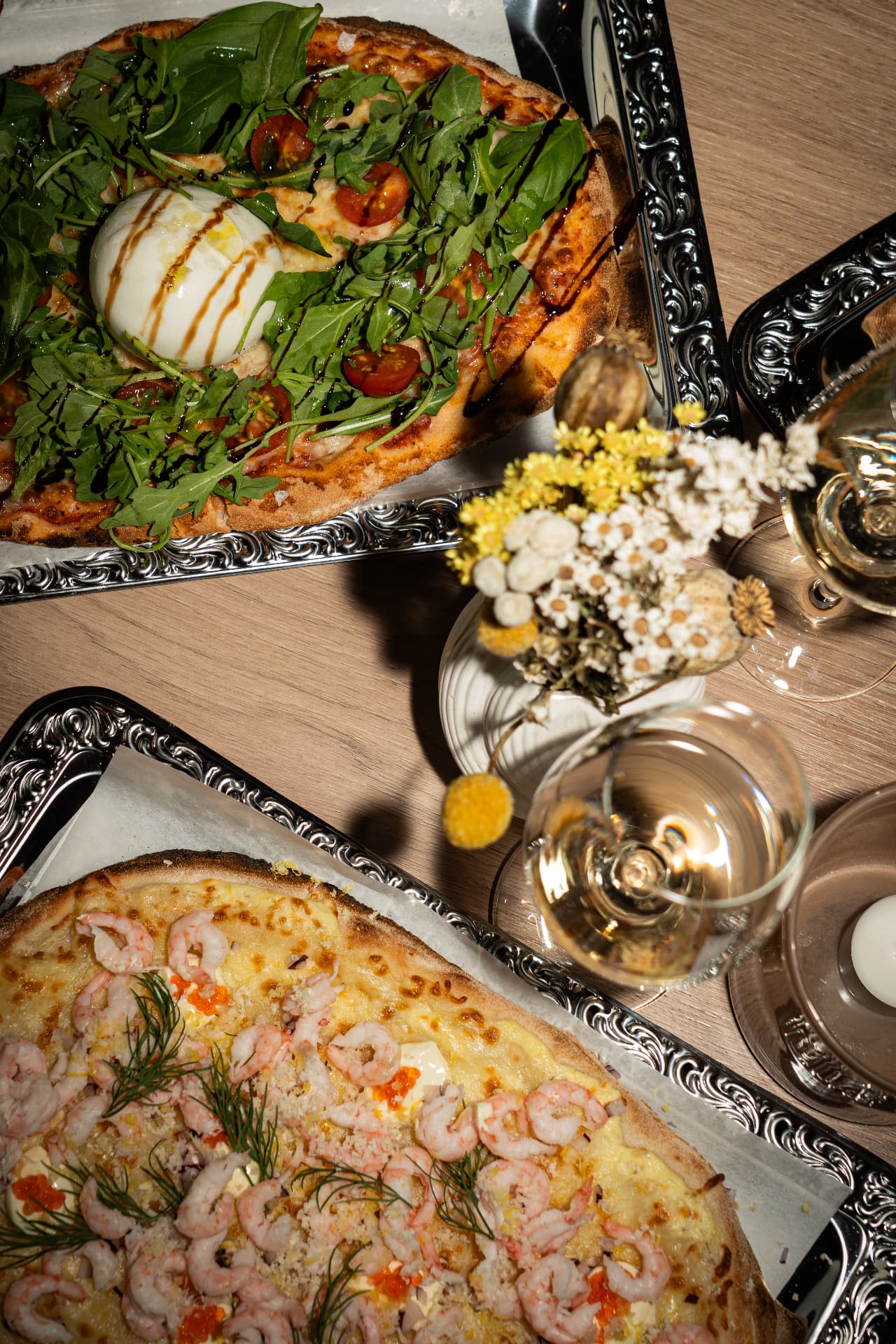Table laid with pinsas and wine to share in Jarlans Wine Café